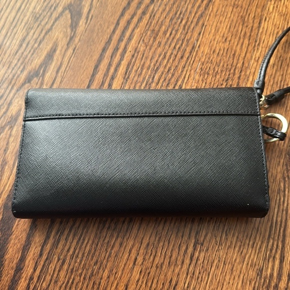 Tory Burch Black Envelope Wallet Wallets for Women for sale  Tory Burch black texture leather golf logo snap flap large wristlet wallet.